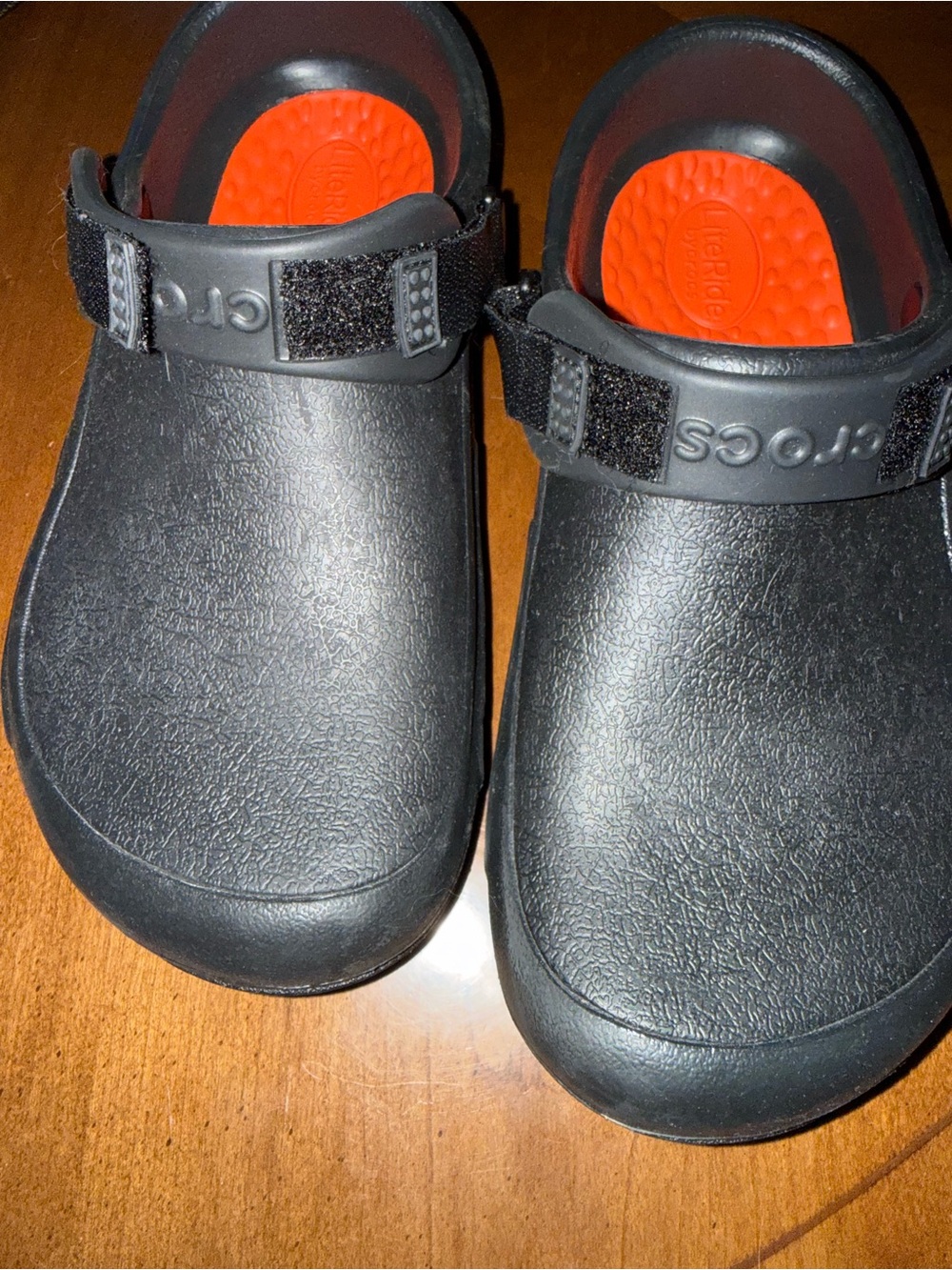 CROCS women’s 9 men 7 Black Clog with Orange Red Insole